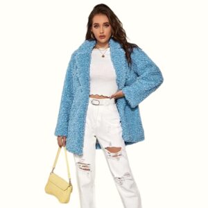 blue teddy faux fur coat model carrying bag scene